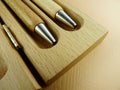 Wooden pens on wooden background