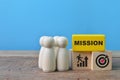 Wooden people figure and wooden blocks with text MISSION Royalty Free Stock Photo