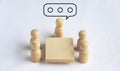 Wooden people figures having business meeting. Business meeting concept Royalty Free Stock Photo