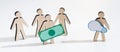 Wooden people with money helping young enterpreneur Royalty Free Stock Photo