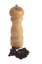 Wooden pepper mill with pepper beans isolated in w Royalty Free Stock Photo