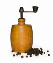 Wooden pepper mill with pepper + clipping path Royalty Free Stock Photo