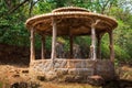 Wooden pergola at a beautiful green garden. Street photo, selective focus. Beautiful gazebo Royalty Free Stock Photo