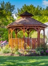 Wooden pergola at the beautiful green garden with flowers Royalty Free Stock Photo
