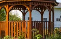 Wooden pergola at the beautiful green garden with flowers. Beautiful gazebo Royalty Free Stock Photo