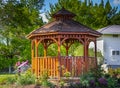 Wooden pergola at the beautiful green garden with flowers Royalty Free Stock Photo