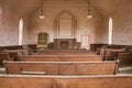 Wooden pews inside rustic wooden church Royalty Free Stock Photo