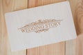 Wooden photo box for photo storage on wooden background. Box with flash with laser engraving \