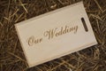 Wooden photo box for photo storage on straw background. Box with flash with laser engraving \