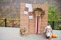 Wooden photo zone on traditional ukrainian wedding.