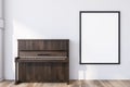 Wooden piano in white room with poster