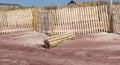 New picket fences being installed by the sand dunes on Fire Island