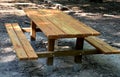 Wooden picnic bench joined table and benches together. bright spruce wood with metal feet. metal feet are better due to the rot of