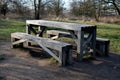 Wooden picnic bench joined table and benches together. bright spruce wood with metal feet. metal feet are better due to the rot of