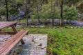 Picnic table and bench in autumn