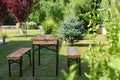Wooden picnic table with benches in park Royalty Free Stock Photo