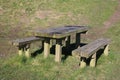 Wooden picnic table and benches in public park Royalty Free Stock Photo