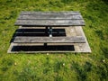 Wooden picnic table on a cement slab in the park