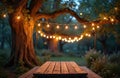 Wooden picnic table in garden with glowing string lights on tree branches. Empty outdoor seating under a canopy of illuminated Royalty Free Stock Photo