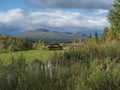 Wooden picninc tables with view on beautiful landscape of Sarek mountains in Kvikkjokk in Swedish Lapland. Summer sunny day,