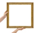 Wooden picture frame in hands isolated on white Royalty Free Stock Photo