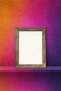 Wooden picture frame leaning on a rainbow shelf. 3d illustration. Vertical background Royalty Free Stock Photo