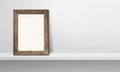 Wooden picture frame leaning on a white shelf. 3d illustration. Horizontal banner Royalty Free Stock Photo