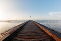 Wooden pier. Beach of Lido di Jesolo at adriatic Sea in a beautiful summer day Italy. near Venice. dense sea breeze at Royalty Free Stock Photo