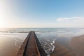 Wooden pier. Beach of Lido di Jesolo at adriatic Sea in a beautiful summer day Italy. near Venice. dense sea breeze at Royalty Free Stock Photo