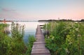 Wooden pier on big lake in summer Royalty Free Stock Photo