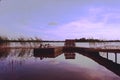 Wooden pier on big lake at the sunset Royalty Free Stock Photo