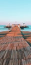 Wooden pier blue sky and turquoise sea Royalty Free Stock Photo