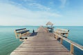 Wooden pier with boat in Phuket, Thailand. Summer, Travel, Vacation and Holiday concept Royalty Free Stock Photo