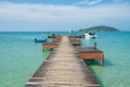 Wooden pier with boat in Phuket, Thailand. Summer, Travel, Vacation and Holiday concept Royalty Free Stock Photo