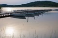 Wooden pier and boats at sunset at Lake Balaton, Hungary Royalty Free Stock Photo