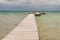 Wooden pier dock and ocean view at Caye Caulker Belize Caribbean Royalty Free Stock Photo