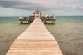 Wooden pier dock and ocean view at Caye caulker Belize Caribbean Royalty Free Stock Photo