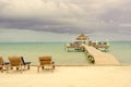 Wooden pier dock and ocean view at Caye Caulker Belize Caribbean Royalty Free Stock Photo