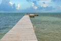 Wooden pier dock and ocean view at Caye Caulker Belize Caribbean Royalty Free Stock Photo