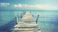 Wooden Pier Extending into Calm Blue Sea Royalty Free Stock Photo