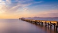 Wooden pier / jetty, playa de muro, Alcudia, sunrise, mountains, secluded beach, golden sunlight, reflection, beautiful sky, Royalty Free Stock Photo