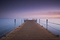 Wooden pier or jetty on sea sunset and sky reflection water. Long exposure, Dahab, Egypt Royalty Free Stock Photo