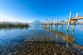 Wooden pier at Lake Atitlan on the shore at Panajachel, Guatemala.  With beautiful landscape scenery of volcanoes Toliman, Atitlan Royalty Free Stock Photo