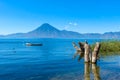 Wooden pier at Lake Atitlan on the shore at Panajachel, Guatemala.  With beautiful landscape scenery of volcanoes Toliman, Atitlan Royalty Free Stock Photo