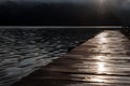 Wooden pier on the lake in the early morning Royalty Free Stock Photo