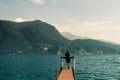 Wooden pier on a lake in Lugano, Switzerland. Royalty Free Stock Photo