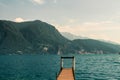 Wooden pier on a lake in Lugano, Switzerland. Royalty Free Stock Photo