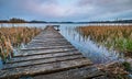 Wooden pier on a lake in Mazury Region, Poland during early morning sunrise