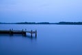 Wooden pier on the lake at night Royalty Free Stock Photo