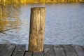 Wooden pier by the lake in summer time. close-up Royalty Free Stock Photo